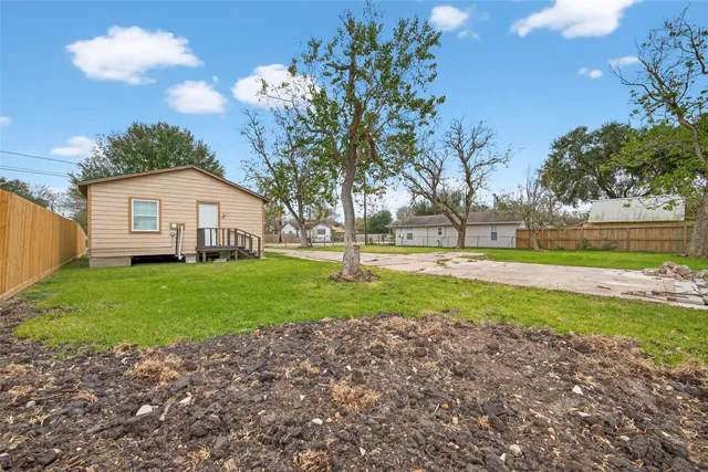 a view of a house with a back yard