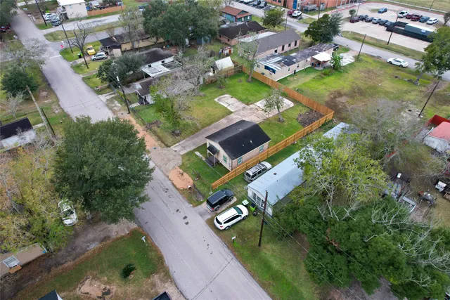 an aerial view of a house with a garden
