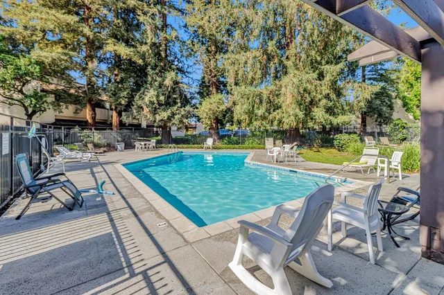 a view of a backyard with sitting area