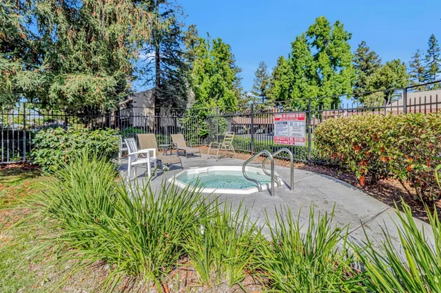 a view of a swimming pool with a patio