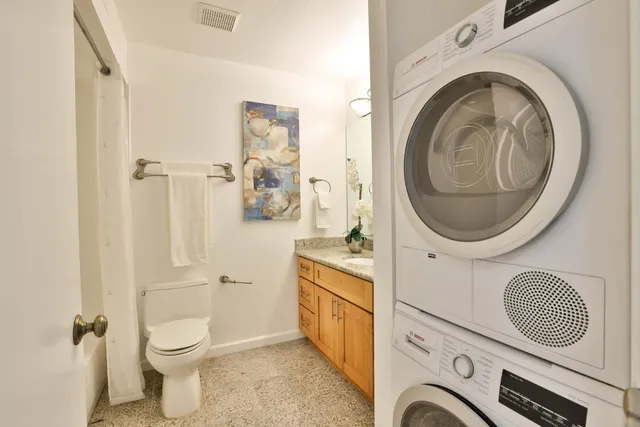 a bathroom with a toilet and a sink