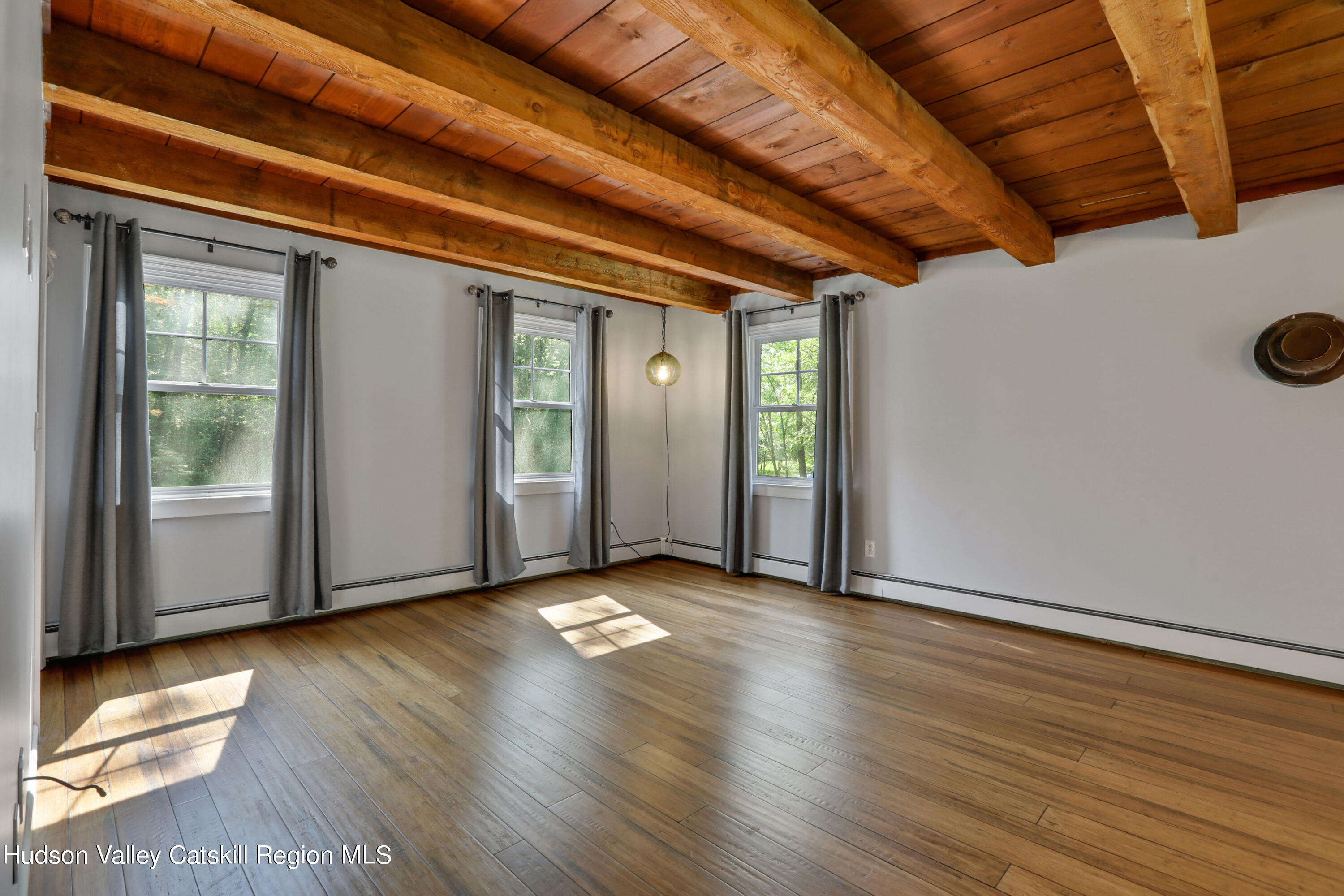 110 Brown Station Road Olivebridge, NY 12461 - Photo 13 of 31 a view of an empty room with wooden floor and a window