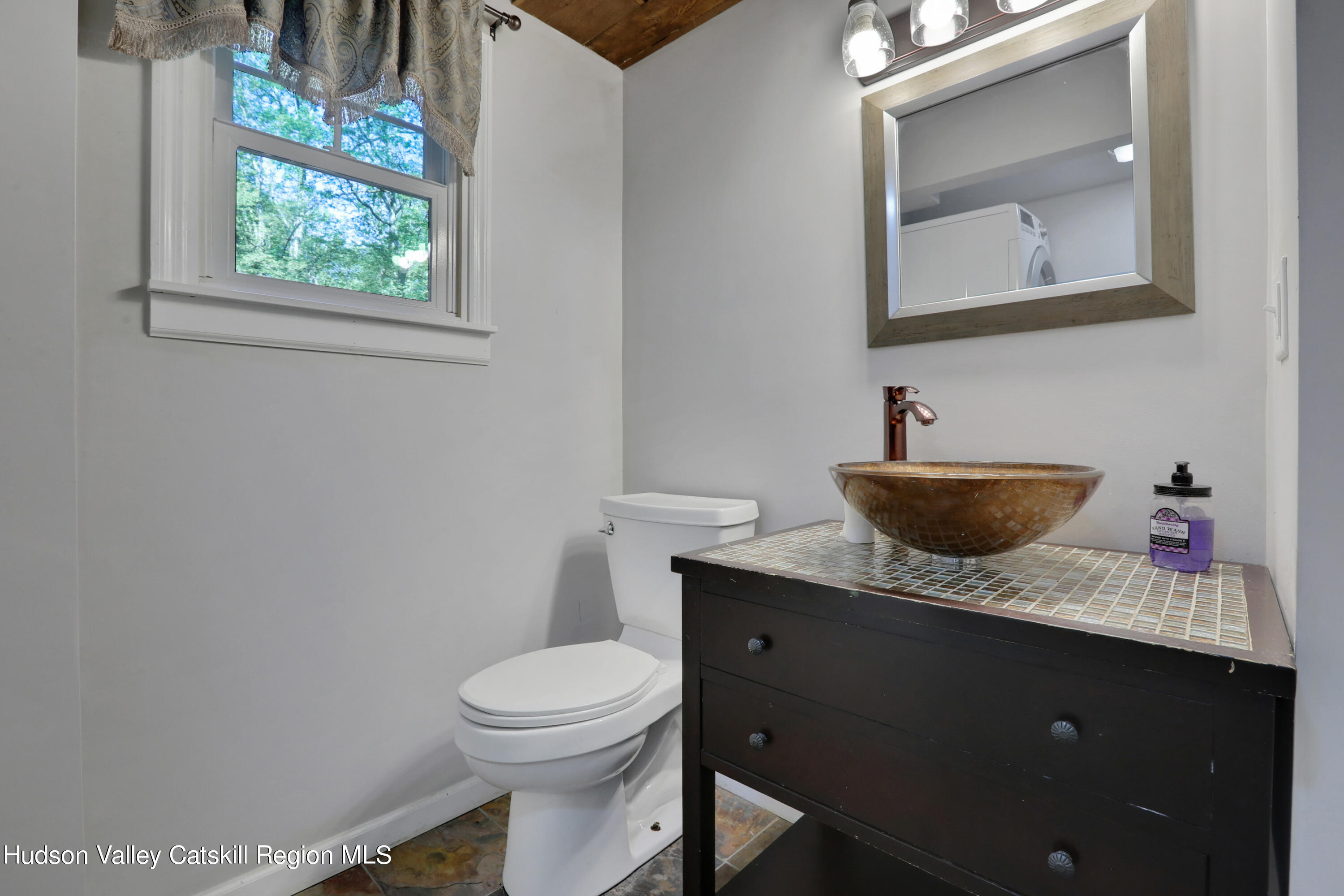 110 Brown Station Road Olivebridge, NY 12461 - Photo 15 of 31 a bathroom with a toilet sink and mirror