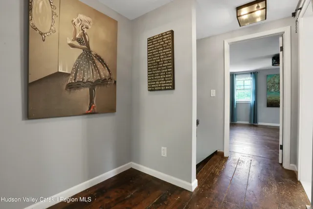 a view of entryway with wooden floor