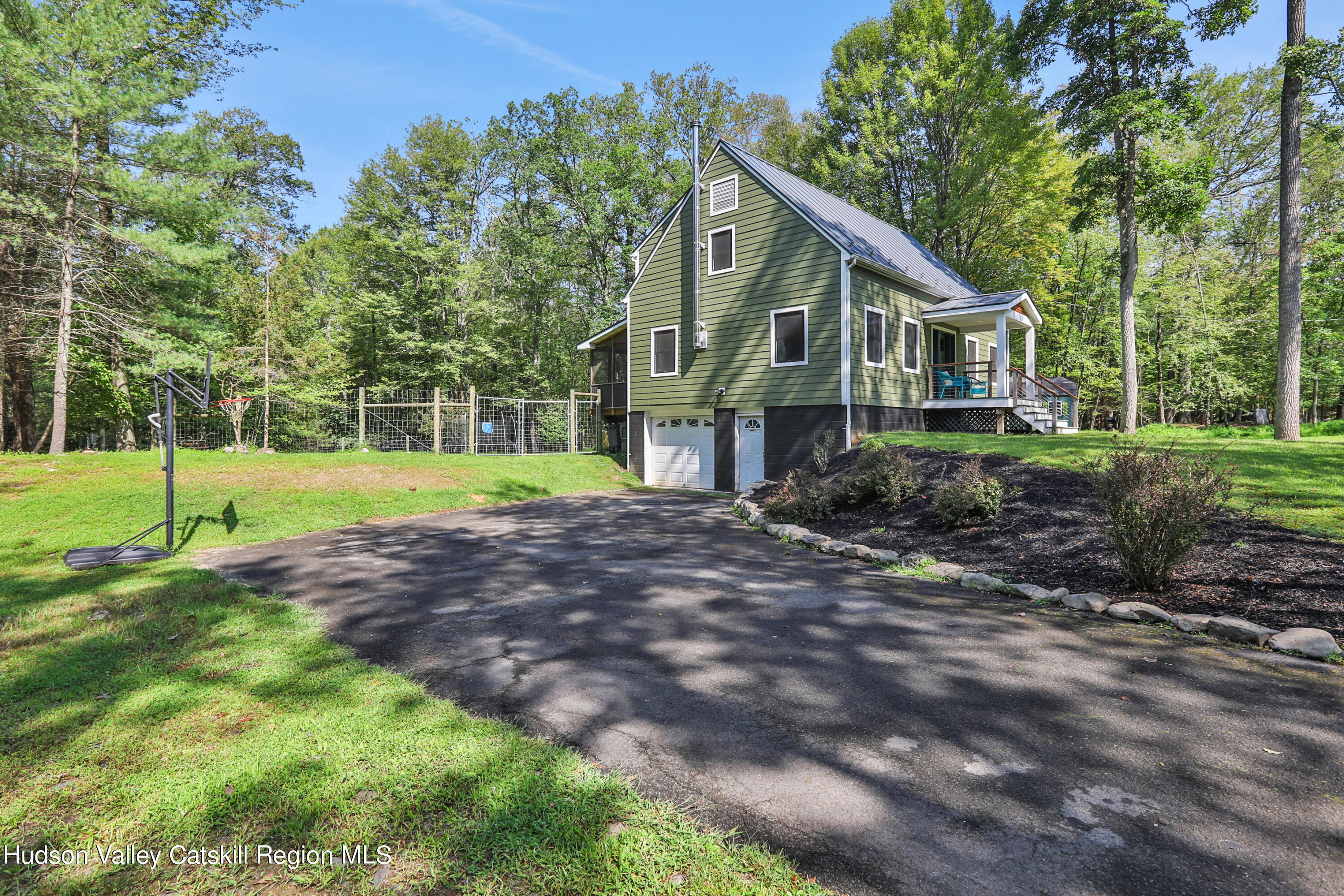 110 Brown Station Road Olivebridge, NY 12461 - Photo 2 of 31 a front view of a house with a yard and trees
