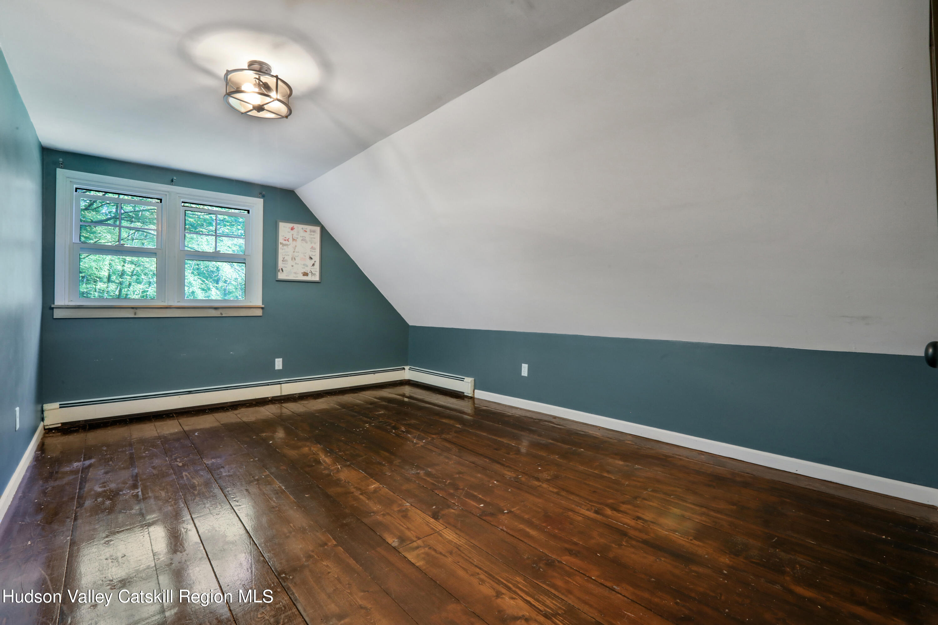 110 Brown Station Road Olivebridge, NY 12461 - Photo 25 of 31 an empty room with wooden floor and windows