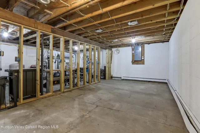 a view of an empty room with wooden walls