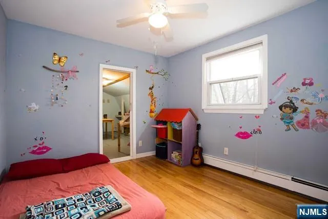 a bedroom with bed and a window