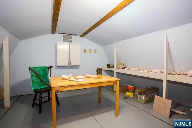 a room with table and chairs