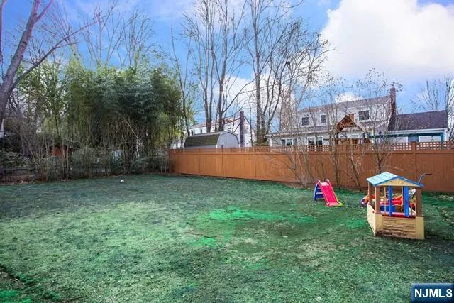 a childrens park with lots of swings and slides