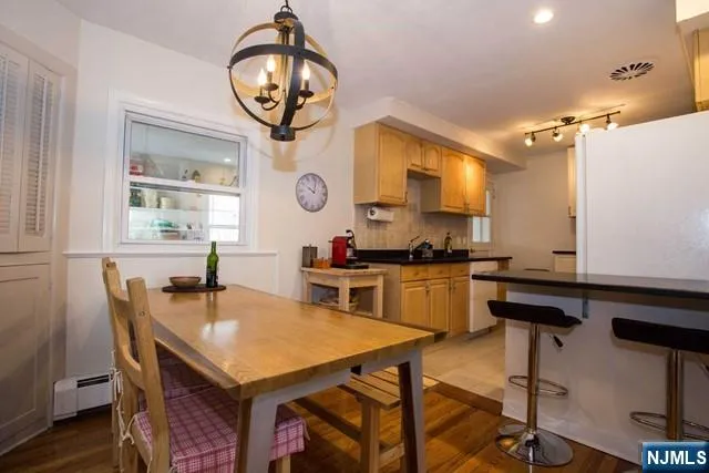 a kitchen with a table chairs and a stove