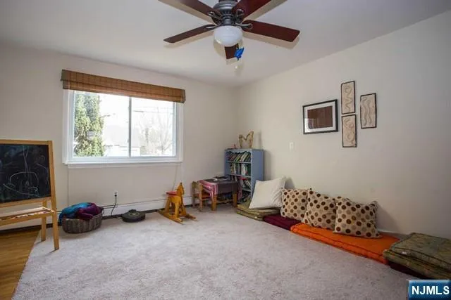 a bed room with furniture and a window