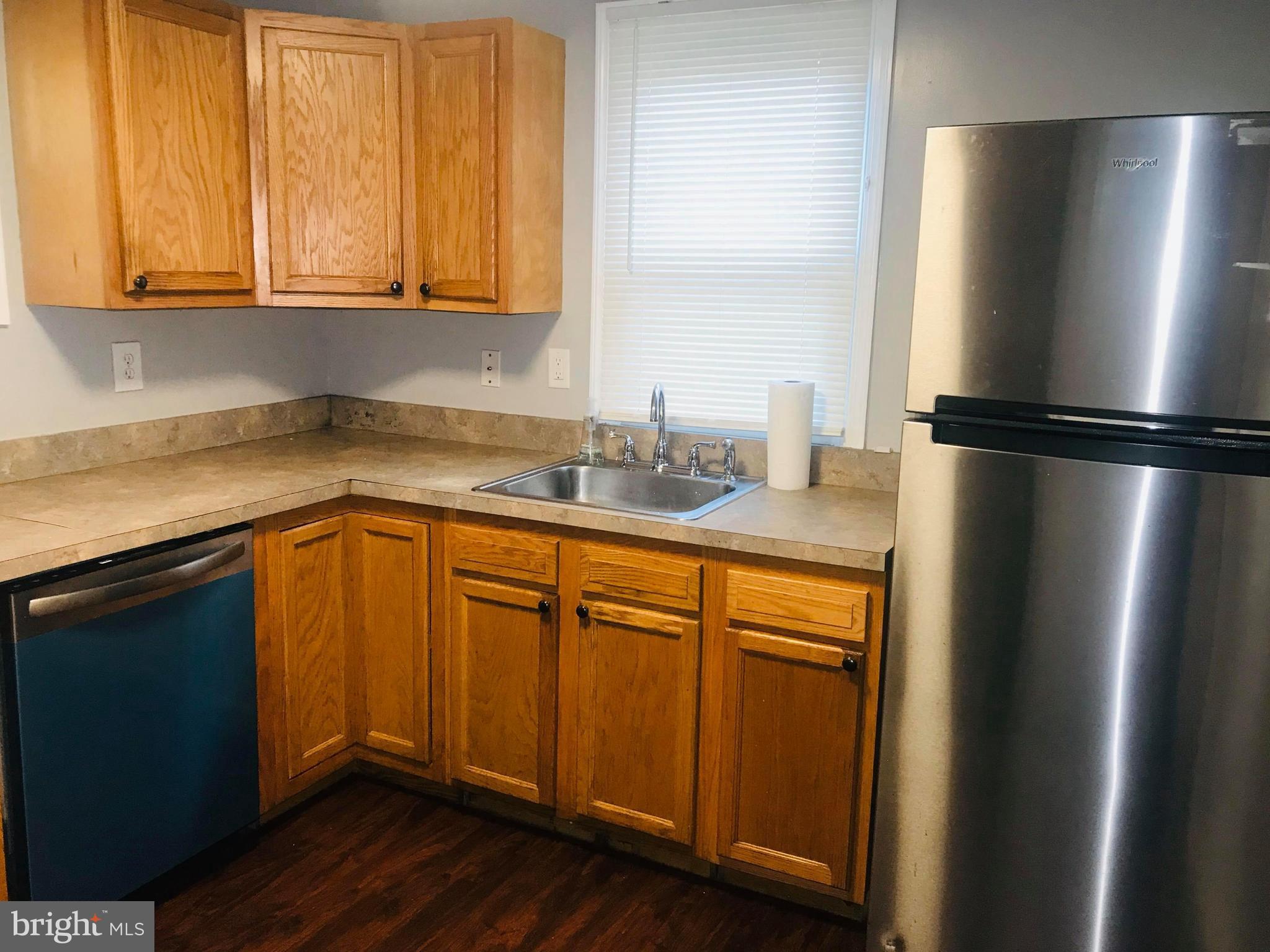 12 Leeway Dundalk, MD 21222 - Photo 13 of 24 a kitchen with stainless steel appliances granite countertop a refrigerator a sink and dishwasher
