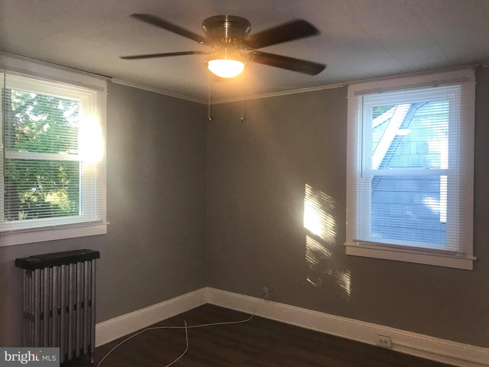 12 Leeway Dundalk, MD 21222 - Photo 21 of 24 a view of empty room with wooden floor and fan