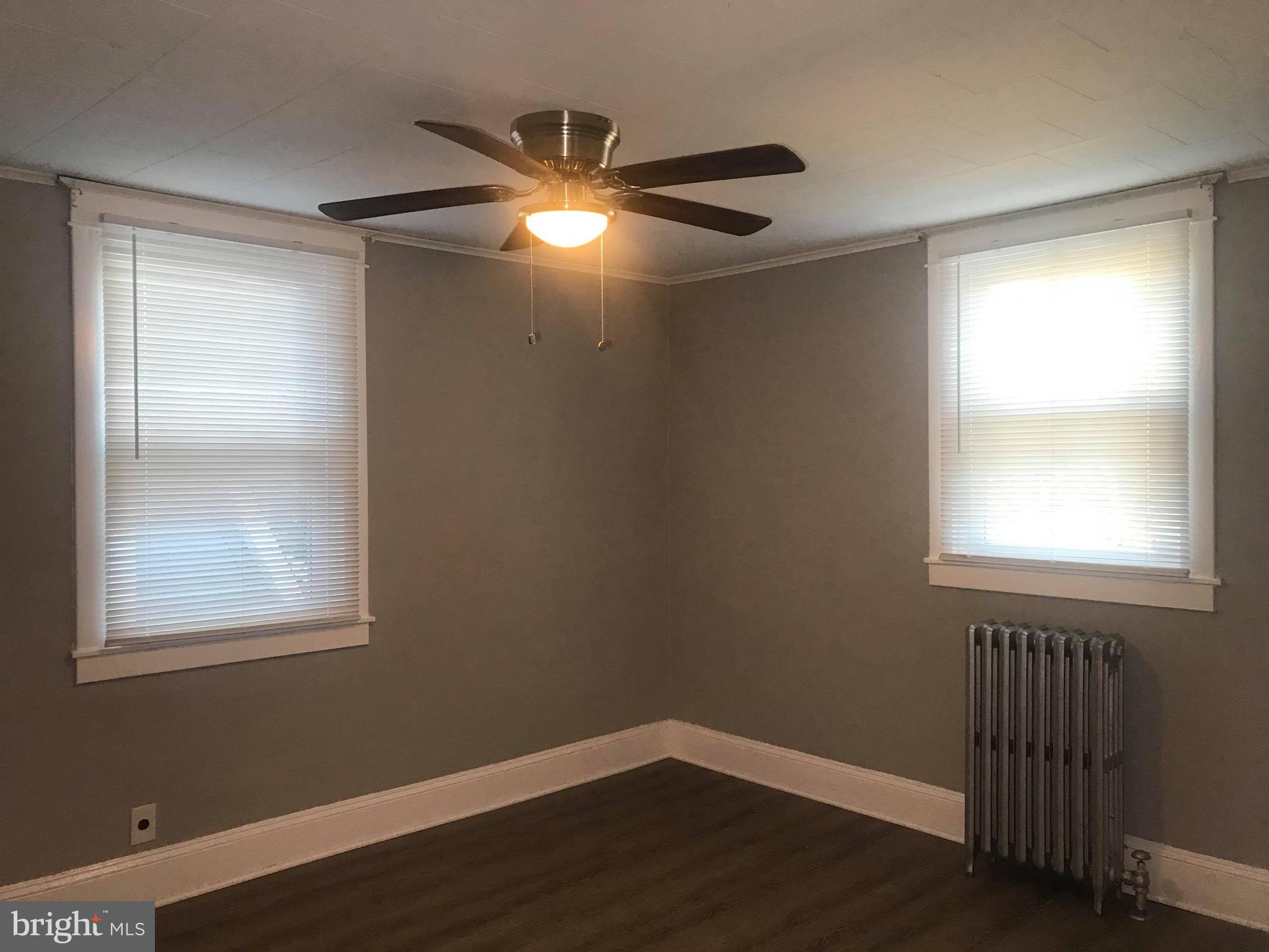 12 Leeway Dundalk, MD 21222 - Photo 23 of 24 a view of an empty room with wooden floor and a window