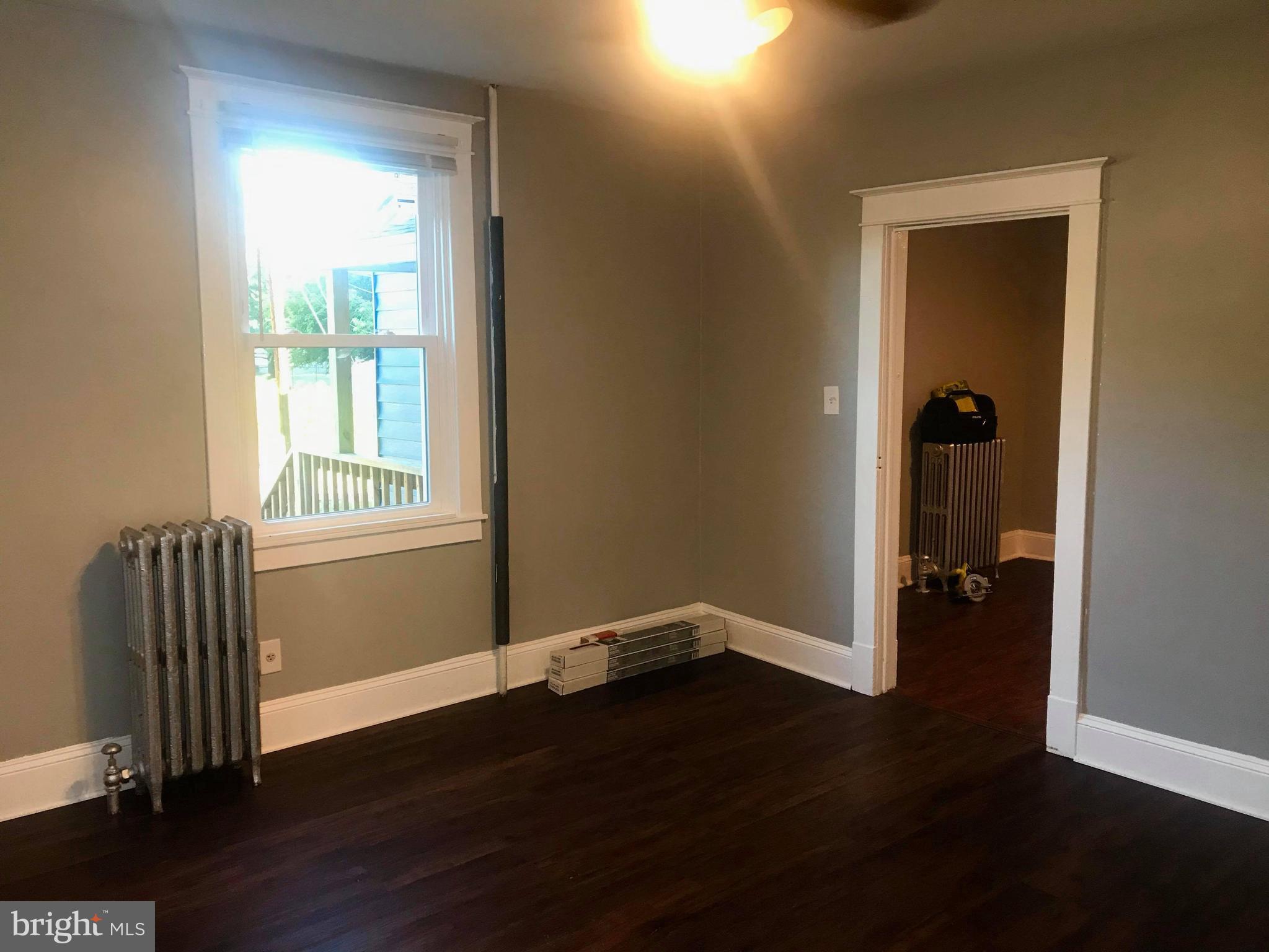 12 Leeway Dundalk, MD 21222 - Photo 3 of 24 a view of livingroom with hardwood floor and a window
