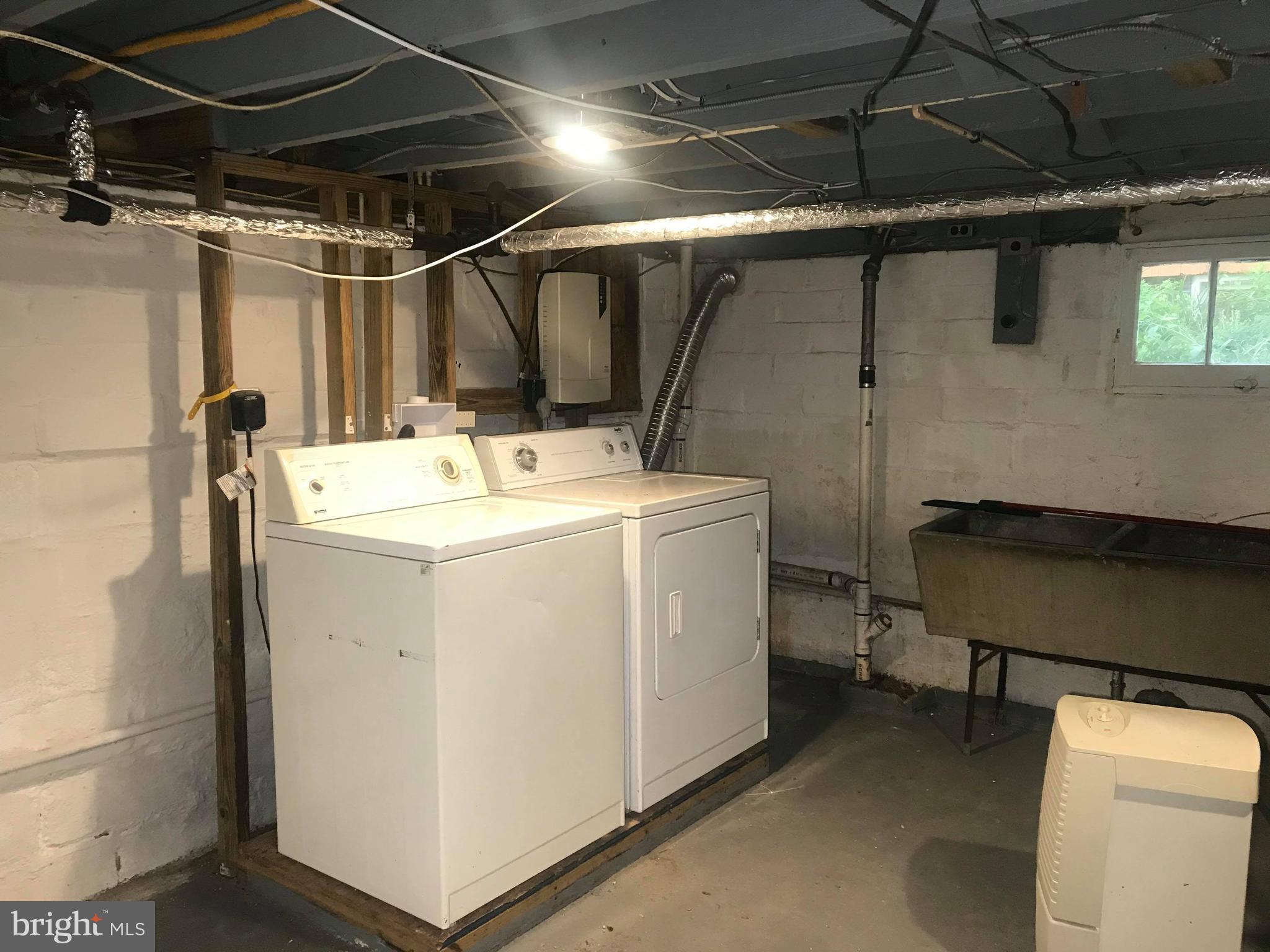 12 Leeway Dundalk, MD 21222 - Photo 6 of 24 a utility room with dryer and washer