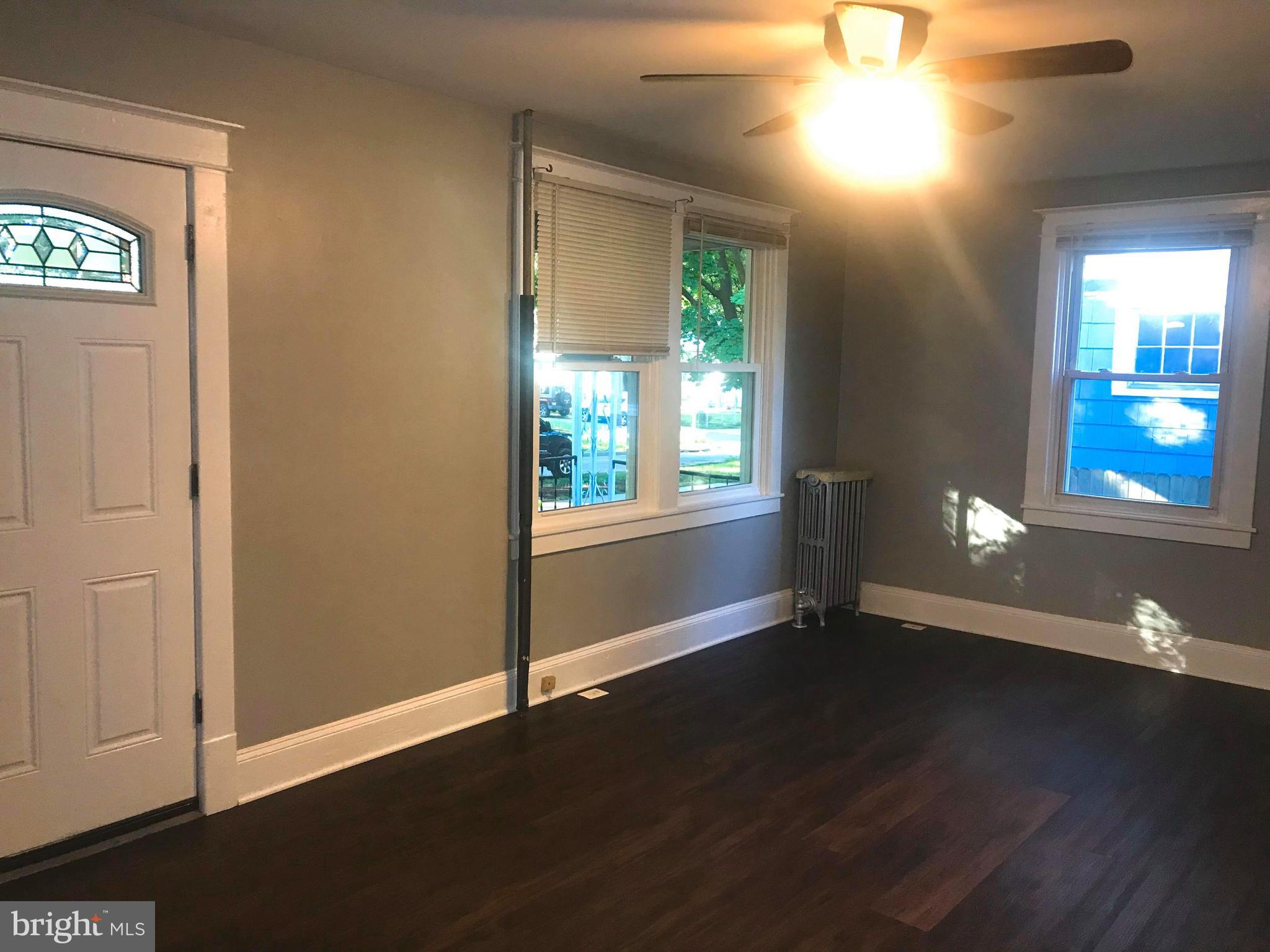 12 Leeway Dundalk, MD 21222 - Photo 9 of 24 an empty room with wooden floor and windows