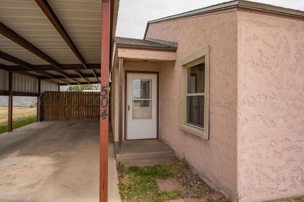 504 East 5th Street Sunray, TX 79086 - Photo 4 of 22 a view of a house with a backyard