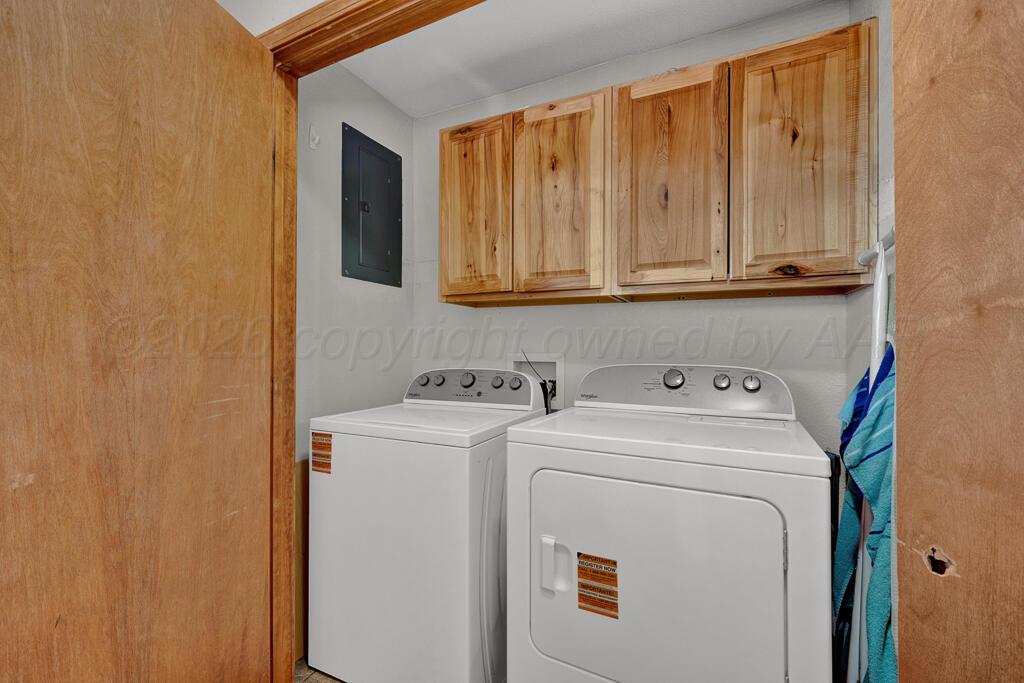 504 East 5th Street Sunray, TX 79086 - Photo 10 of 22 a view of storage and utility room with washer and dryer