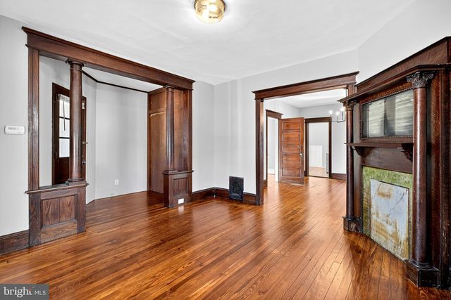 a view of a livingroom with a ceiling fan and window