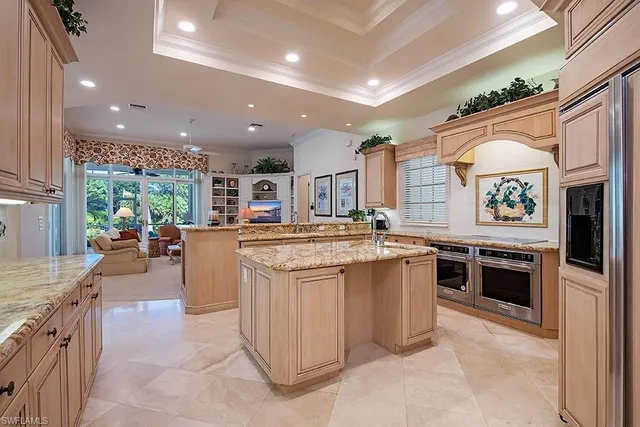 a kitchen with stainless steel appliances granite countertop a stove and more cabinets