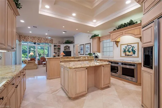 a kitchen with kitchen island granite countertop lots of counter top space and stainless steel appliances