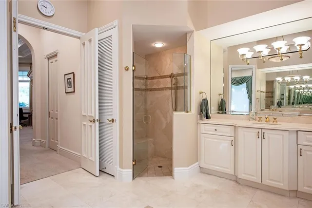 a bathroom with a shower sink and mirror