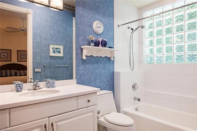 a bathroom with a sink toilet tub and shower