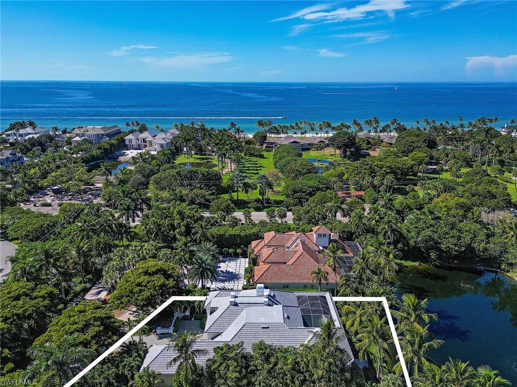 309 Little Harbour Lane Naples, FL 34102 - Photo 28 of 30 an aerial view of a house with a lake view