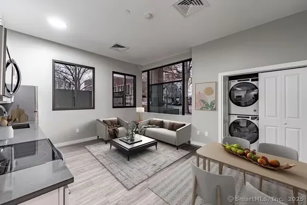 a living room with furniture and a window