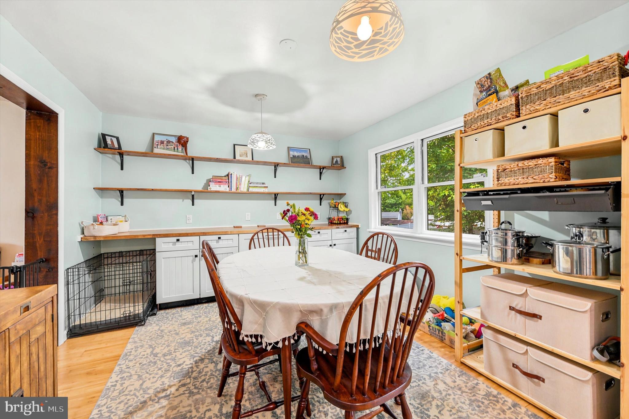 319 Willowbrook Road Upper Chichester, PA 19061 - Photo 7 of 24 a dining room with furniture a rug a painting and a potted plant