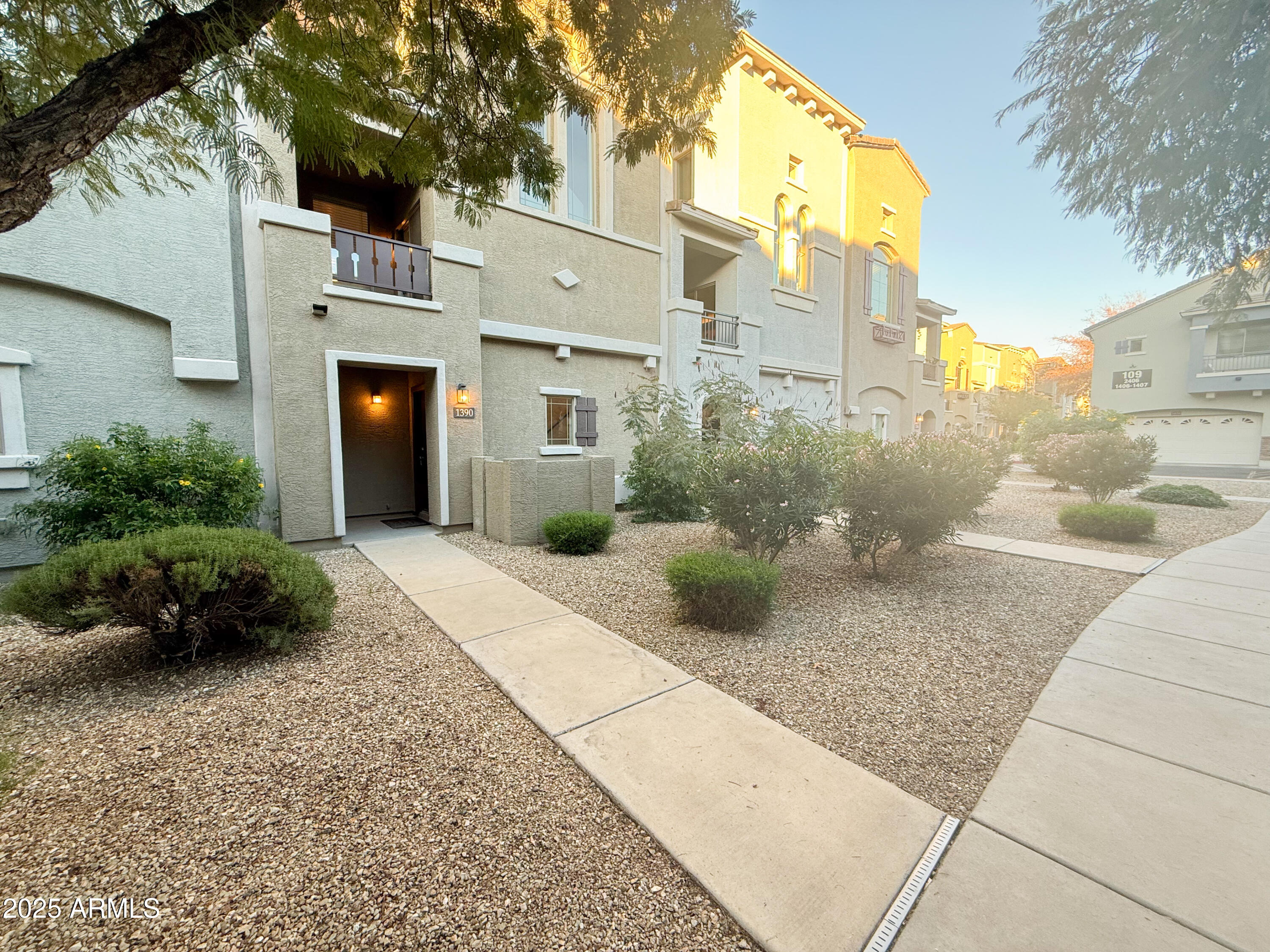a view of a building with potted plants