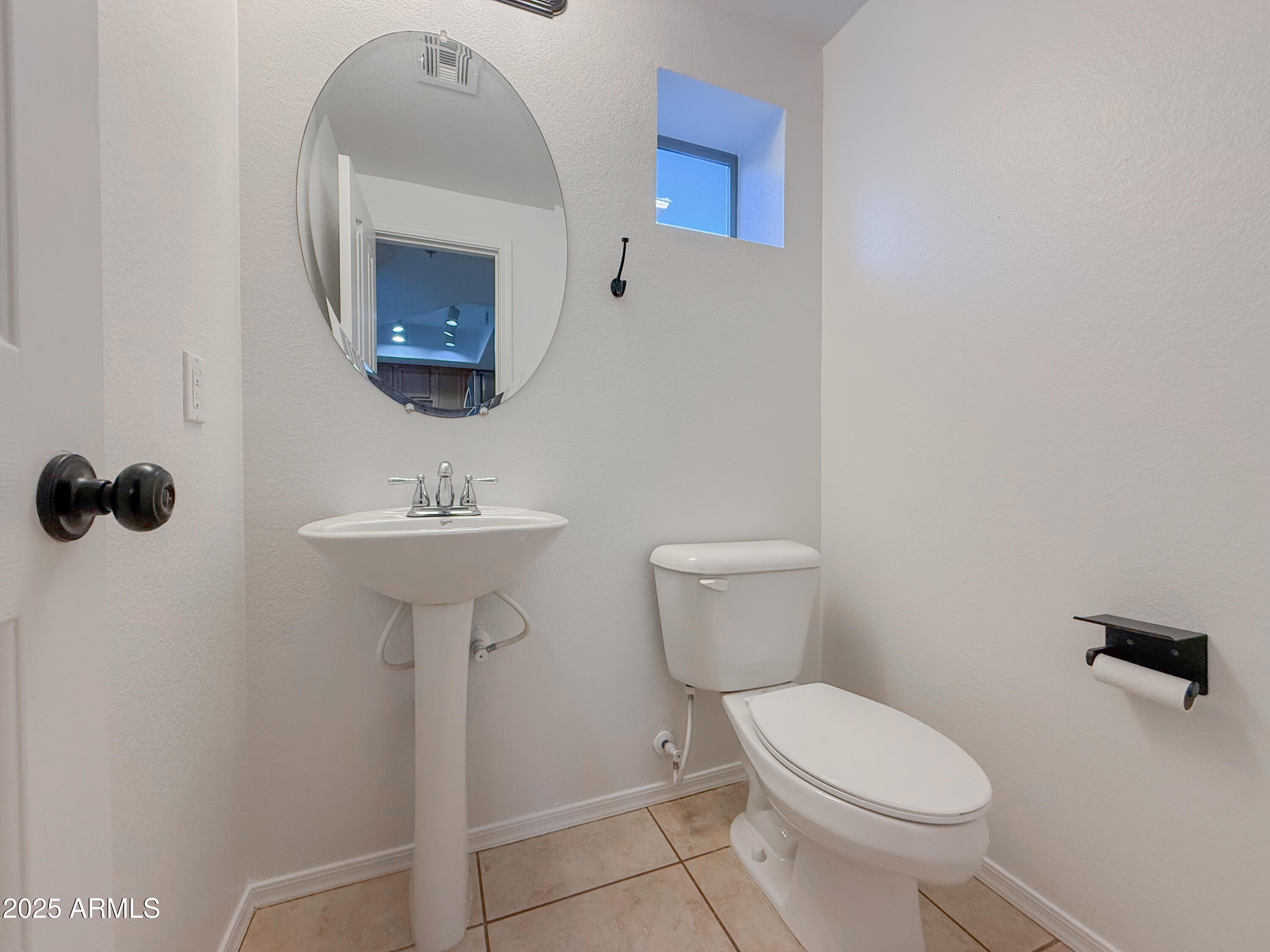 2150 West Alameda Road, Unit 1390 Phoenix, AZ 85085 - Photo 11 of 28 a bathroom with a toilet a sink and mirror