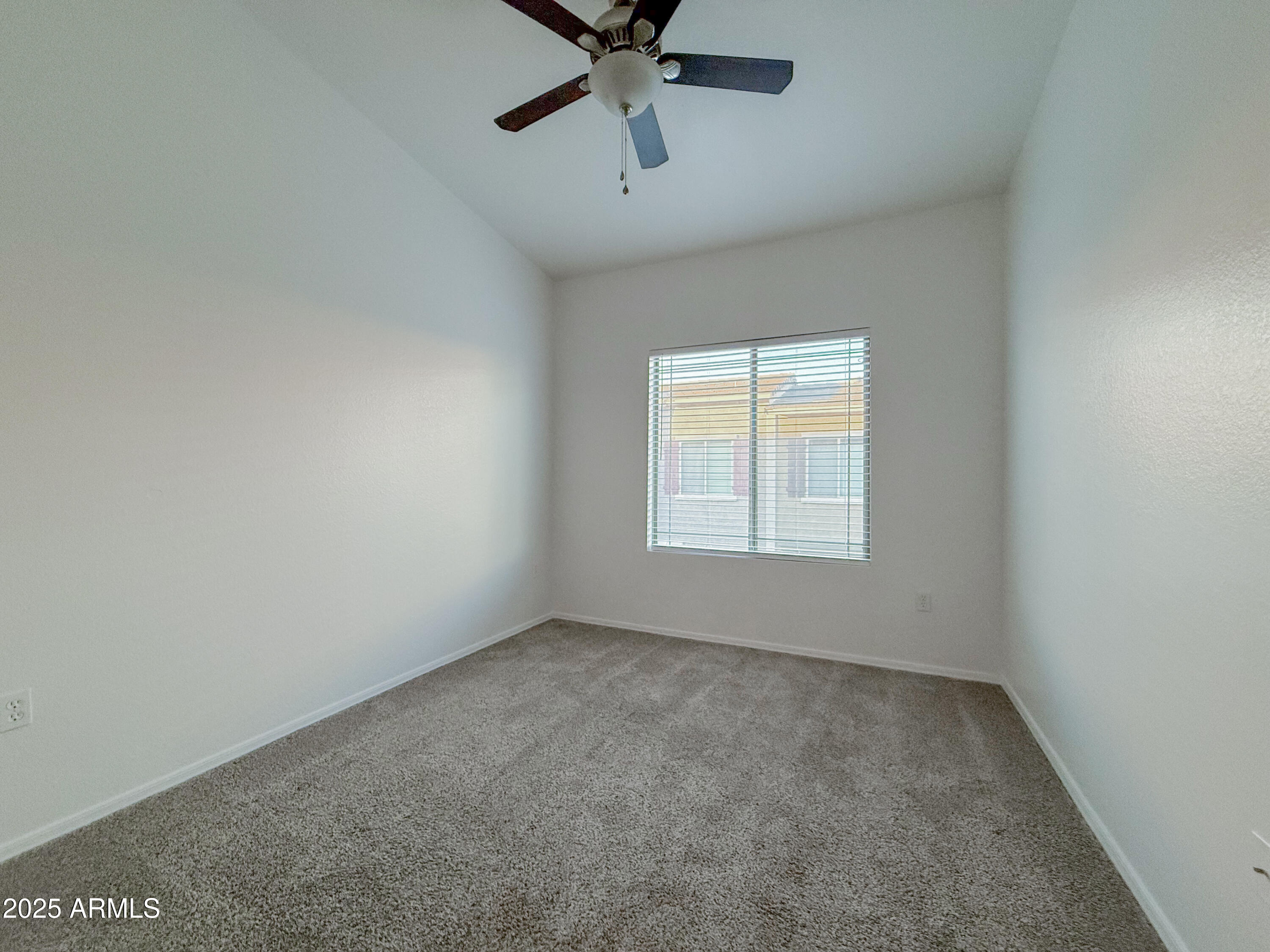 2150 West Alameda Road, Unit 1390 Phoenix, AZ 85085 - Photo 12 of 28 an empty room with a ceiling fan and window