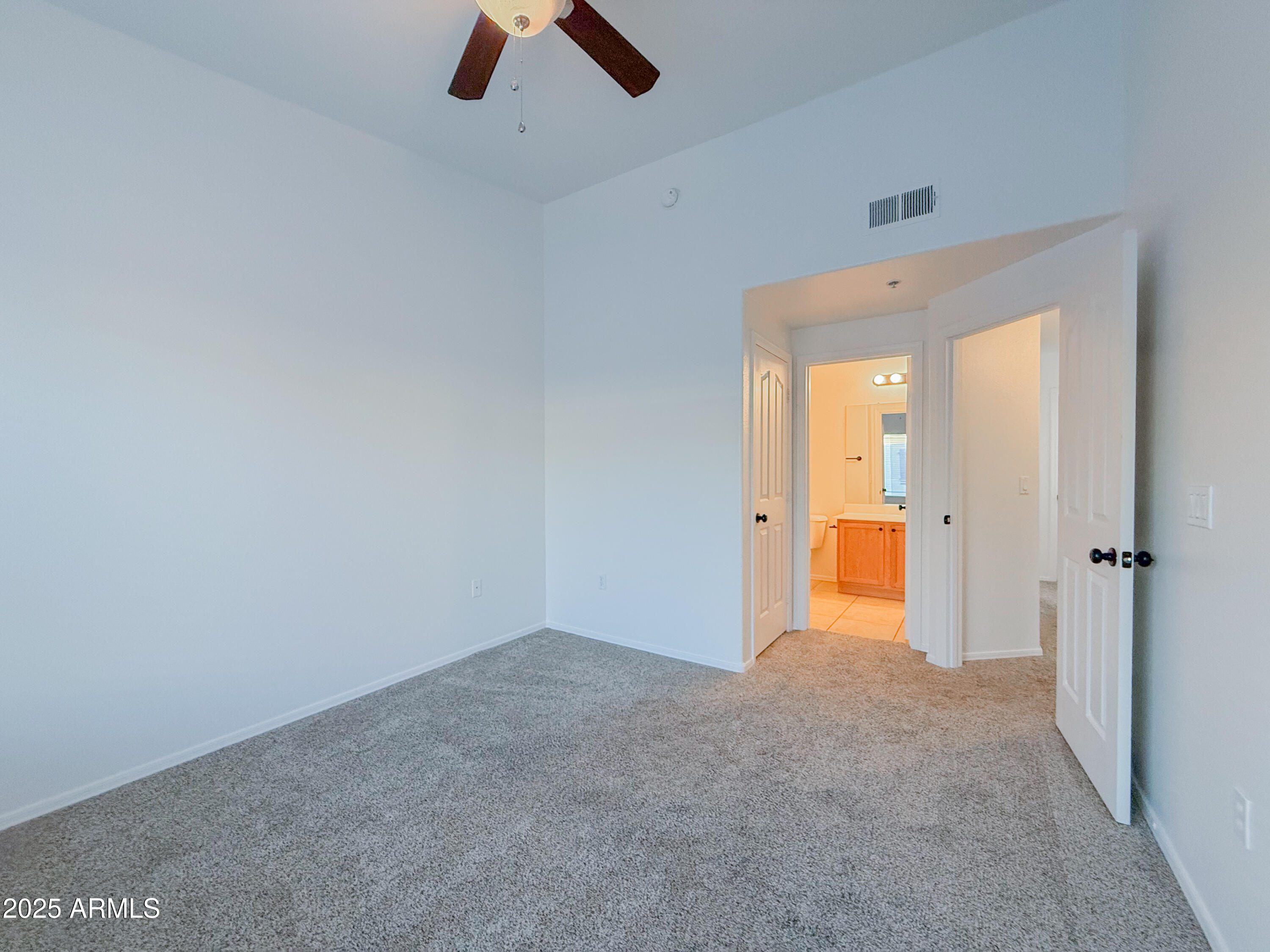 2150 West Alameda Road, Unit 1390 Phoenix, AZ 85085 - Photo 18 of 28 an empty room with closet and window