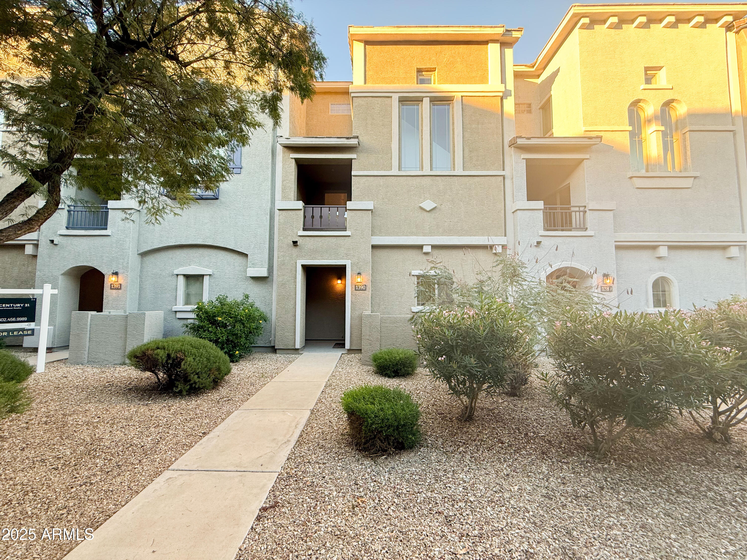 2150 West Alameda Road, Unit 1390 Phoenix, AZ 85085 - Photo 2 of 28 a front view of a house with garden