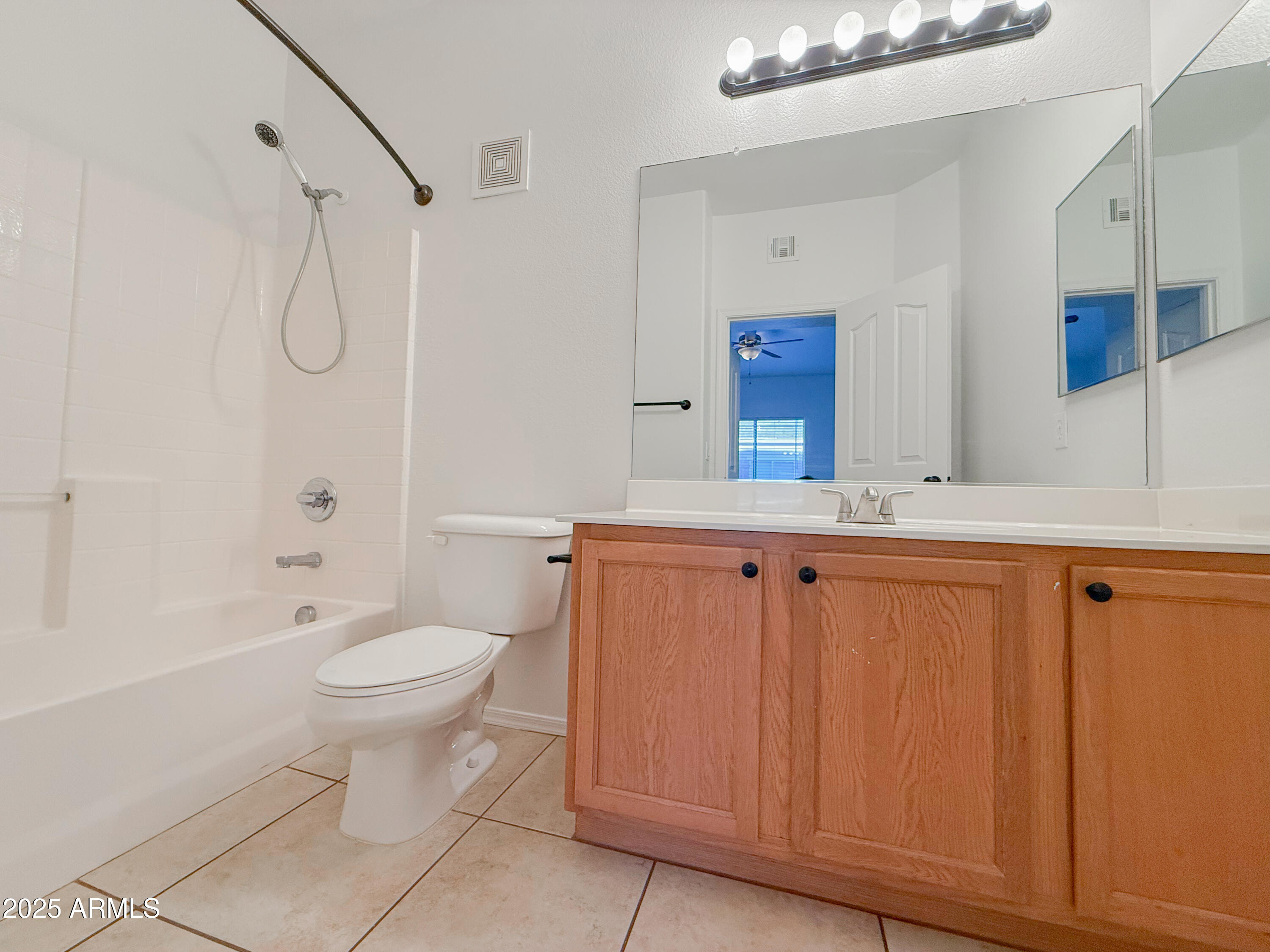 2150 West Alameda Road, Unit 1390 Phoenix, AZ 85085 - Photo 21 of 28 a bathroom with a granite countertop sink toilet and shower