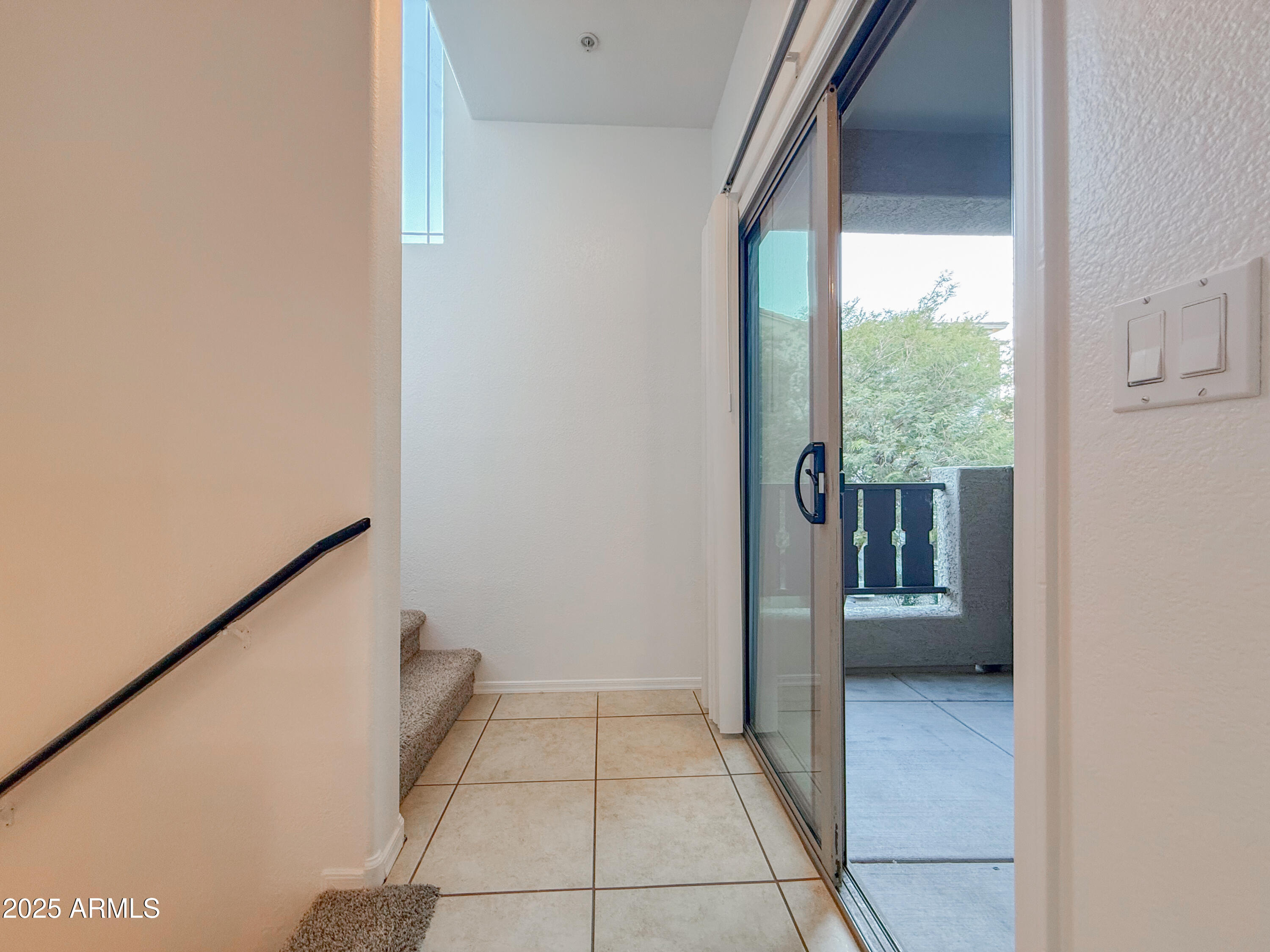 2150 West Alameda Road, Unit 1390 Phoenix, AZ 85085 - Photo 23 of 28 a view of a hallway with a outdoor space