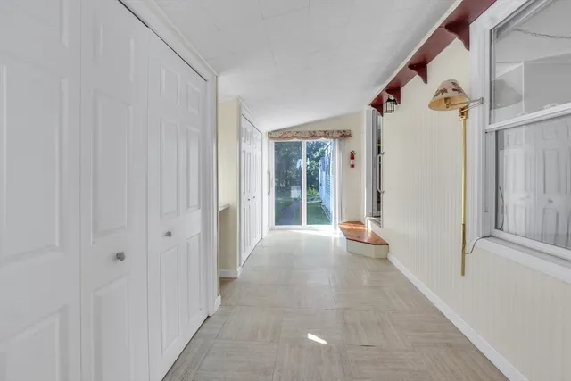 a view of a bathroom with a tub and shower