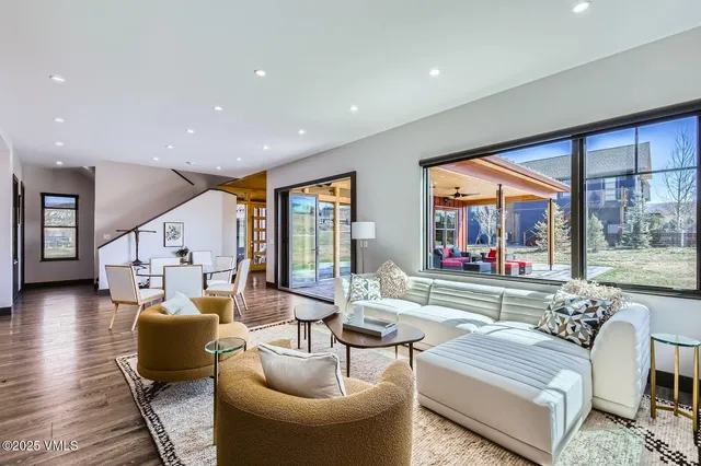 a kitchen with granite countertop a sink stove and refrigerator