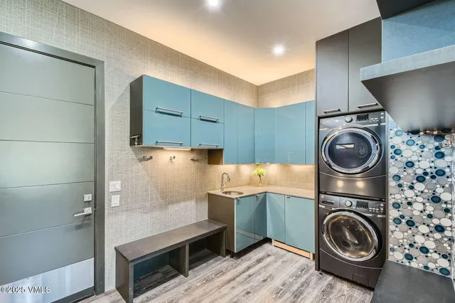 a bathroom with a double vanity sink toilet mirror and shower