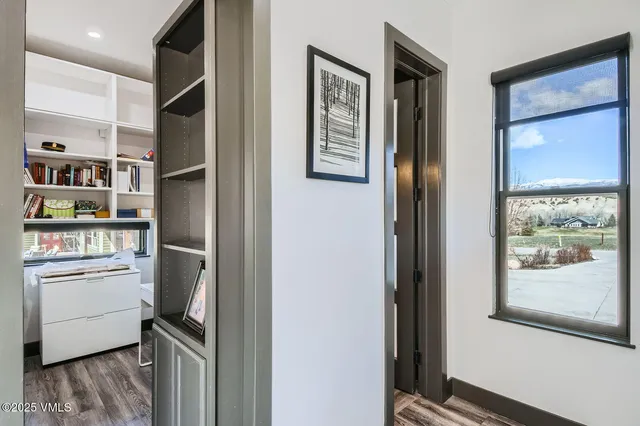 a bathroom with a sink vanity mirror and toilet