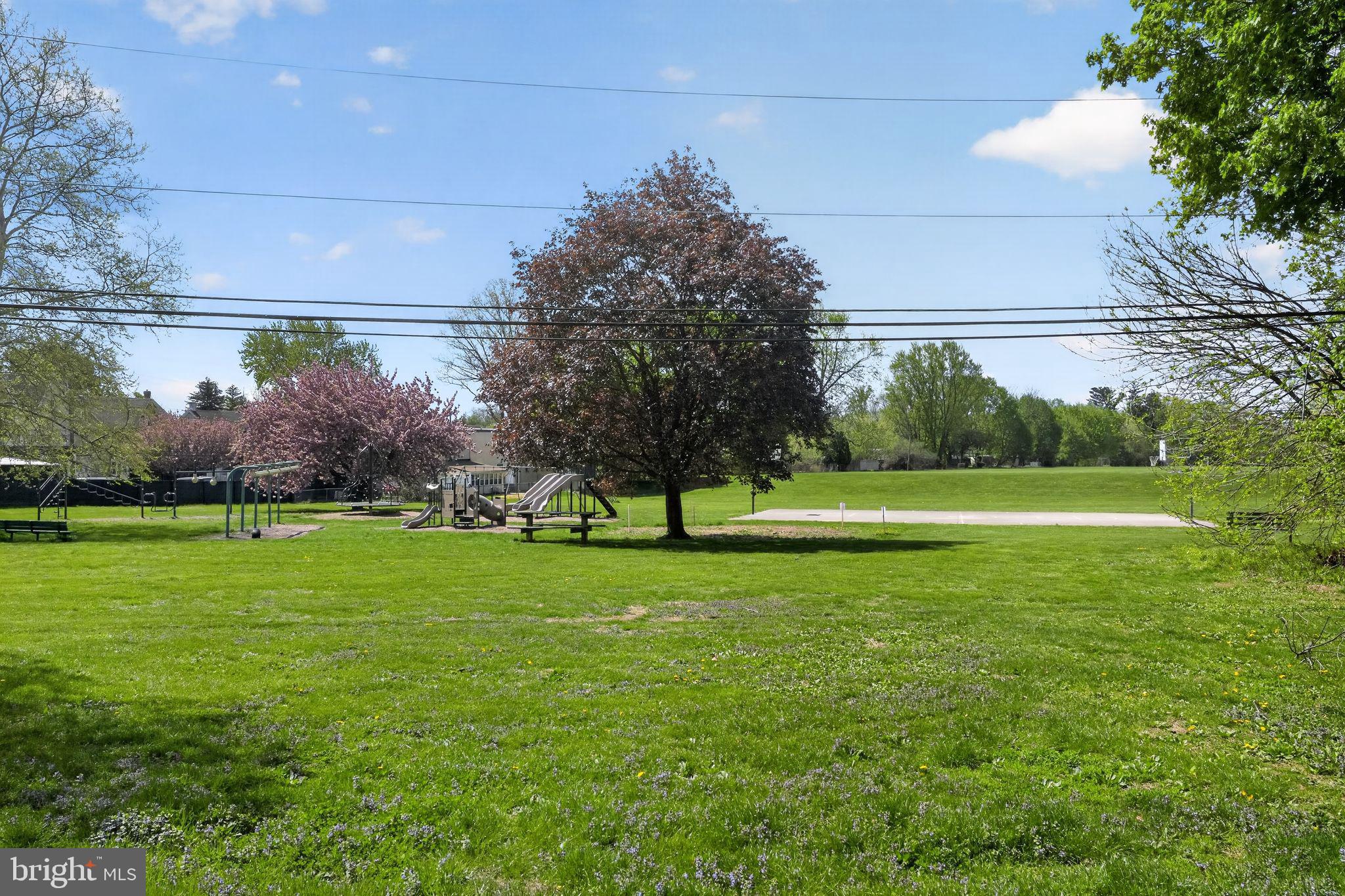 633 Dayton Road Bryn Mawr, PA 19010 - Photo 12 of 18 a view of a golf course with a lake