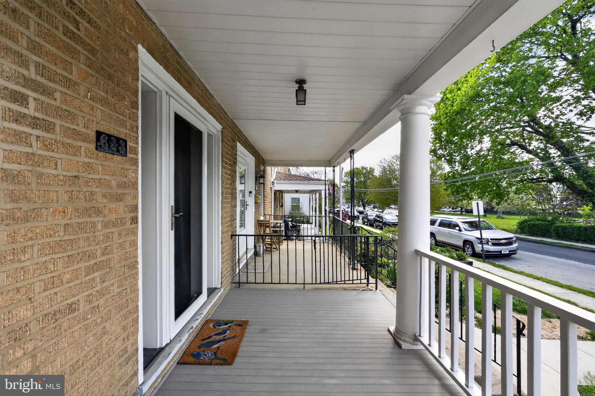 633 Dayton Road Bryn Mawr, PA 19010 - Photo 2 of 18 a view of a porch with wooden floor and outdoor space