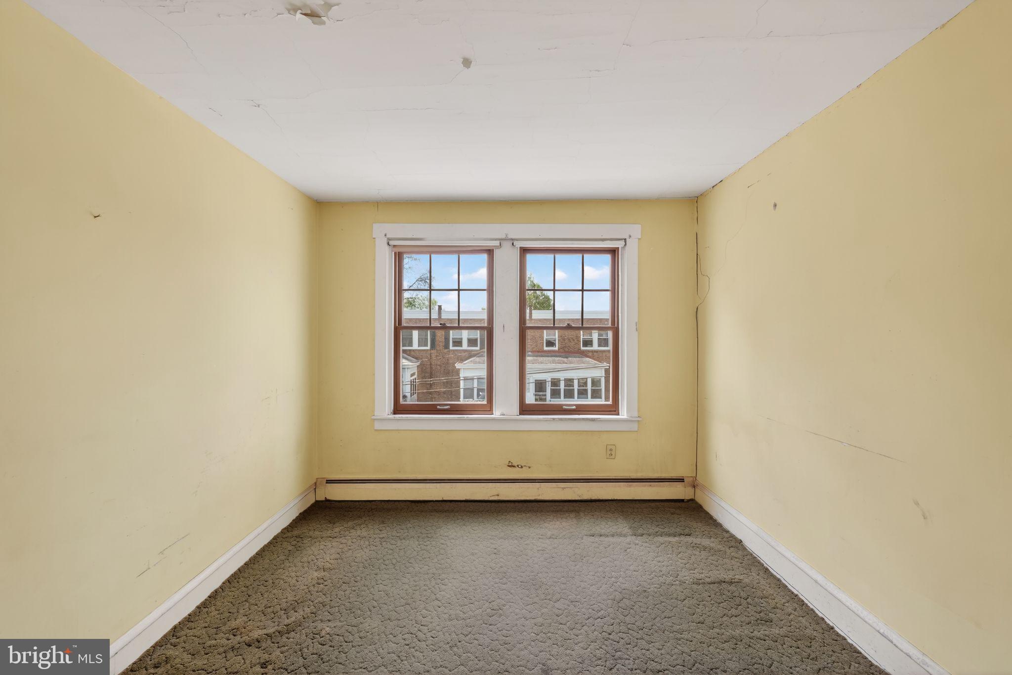 633 Dayton Road Bryn Mawr, PA 19010 - Photo 8 of 18 a view of an empty room with a window