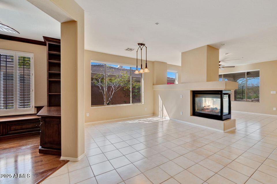 41526 North Cedar Chase Road Anthem, AZ 85086 - Photo 2 of 14 a view of a livingroom with a fireplace and window