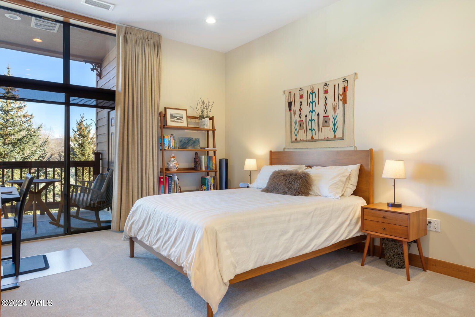 295 Main Street, Unit R202 Edwards, CO 81632 - Photo 16 of 26 a bedroom with a bed and a large window