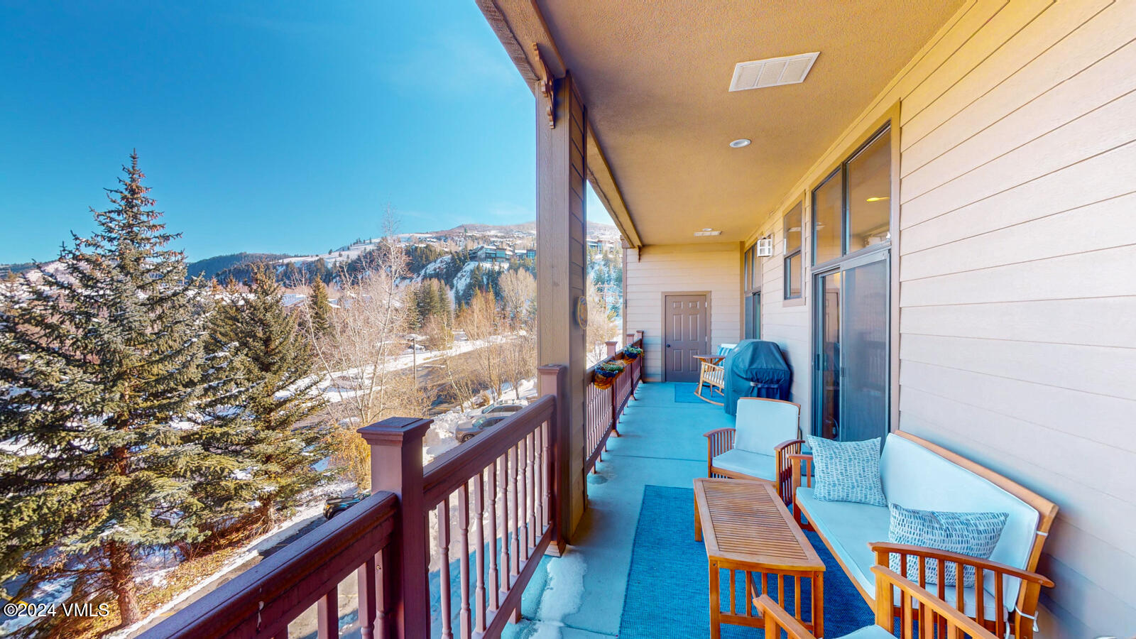 295 Main Street, Unit R202 Edwards, CO 81632 - Photo 25 of 26 a balcony with chairs and a table