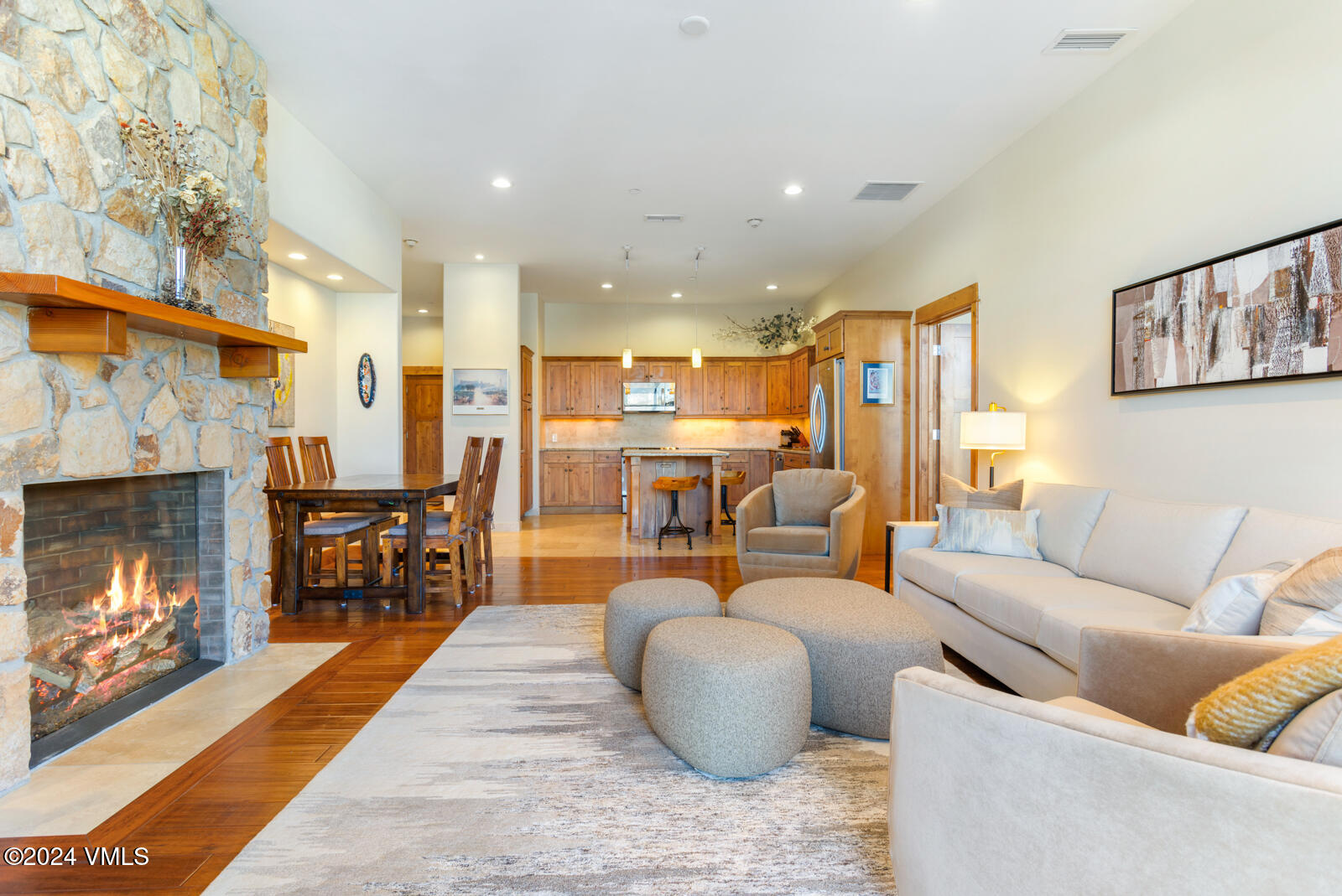 295 Main Street, Unit R202 Edwards, CO 81632 - Photo 3 of 26 a living room with furniture and a fireplace